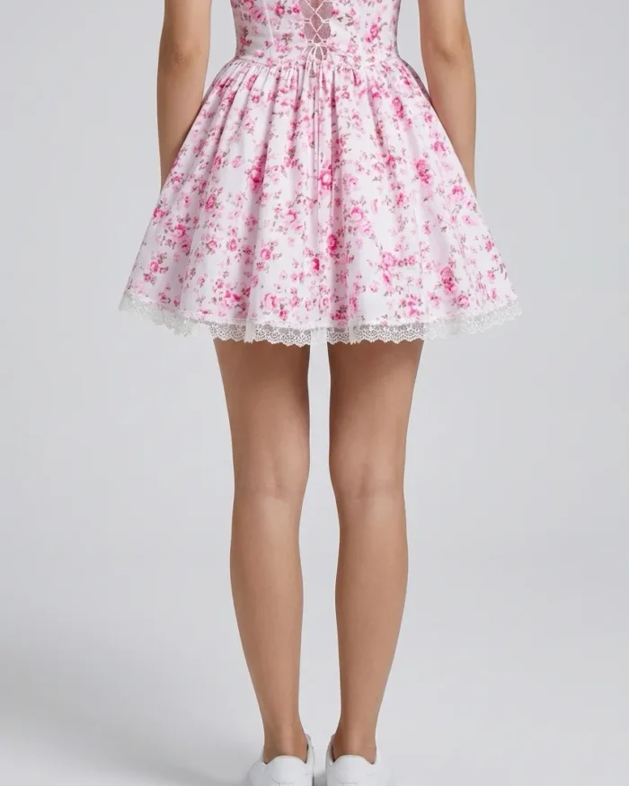 The Heirloom Bloom pink floral mini dress with lace trim and structured bodice